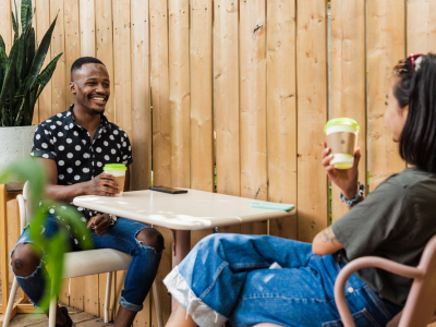 enjoying-a-coffee-on-a-sunny-patio.webp